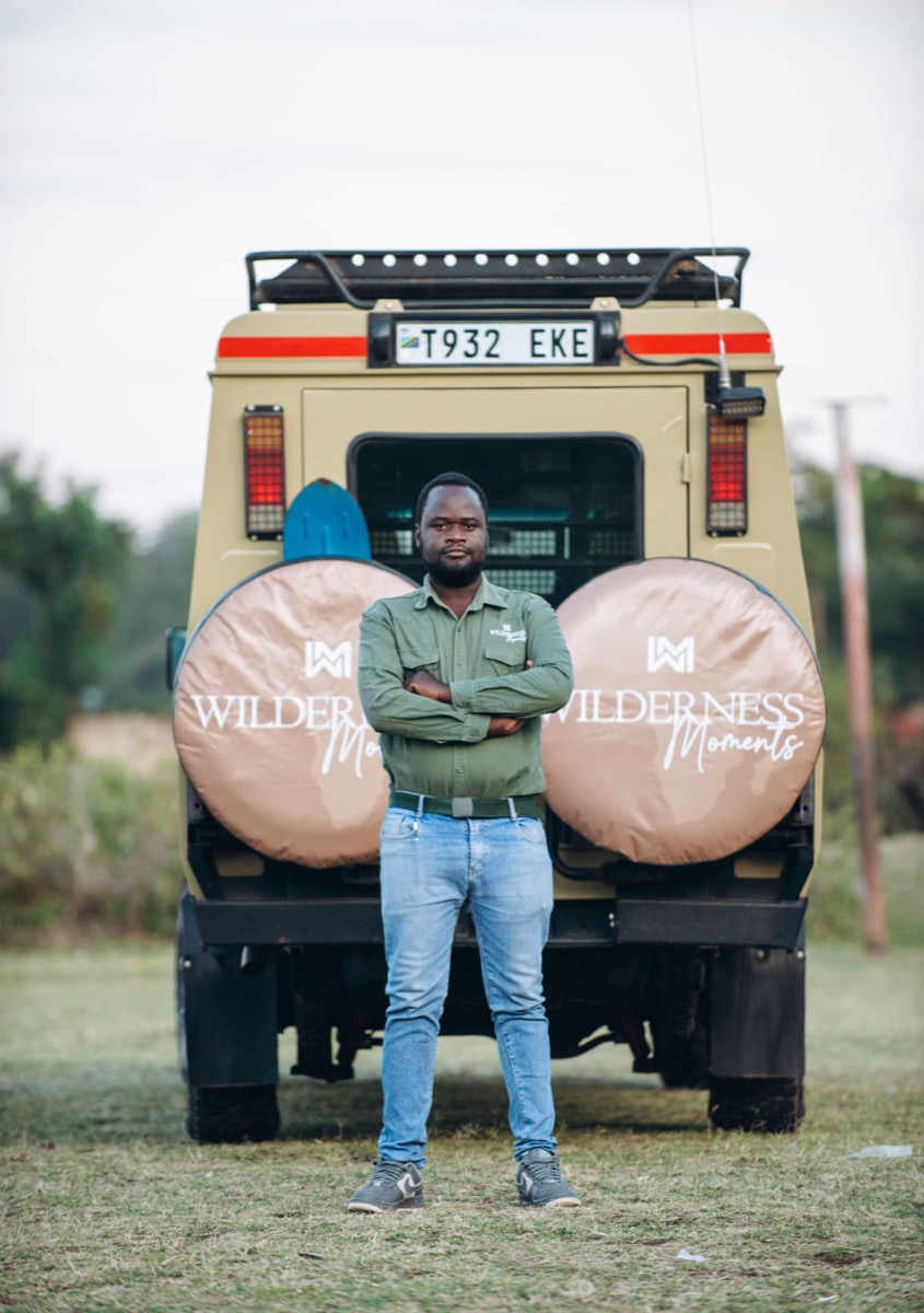 Guide with the safari vehicle